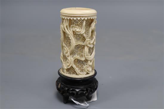 A Chinese carved and pierced ivory dragon vase, wood stand, overall height 11.5cm